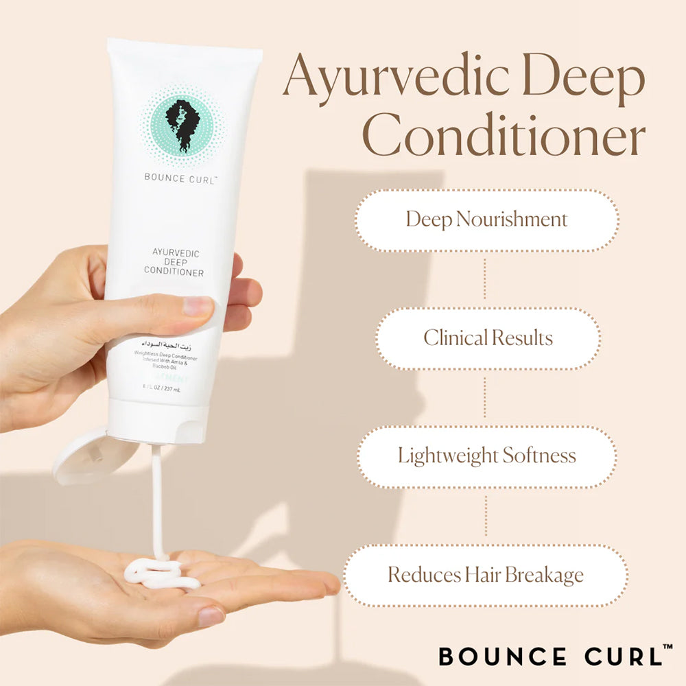 Bounce Curl Ayurvedic Deep Conditioner 237ml presses ud i hånd, med fokus på blødhed, næring og mindre hårbrud.